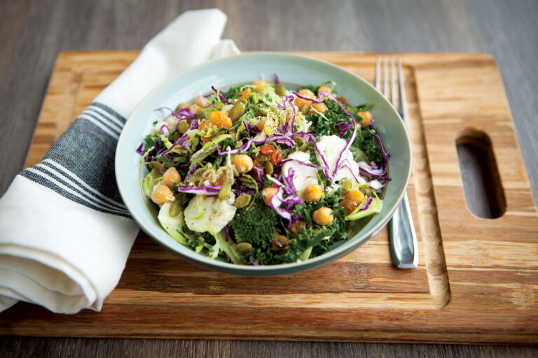 Relatives salad in a bowl on a chopping board with a tablecloth