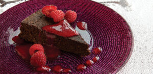Flourless Chocolate Date Cake with Raspberry Coulis
