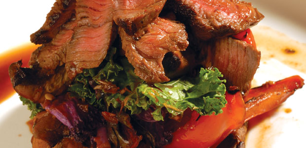 Grilled Bison Flat Iron Steak with Wilted Wintergreens and Marinated Chili Mushrooms and Peppers