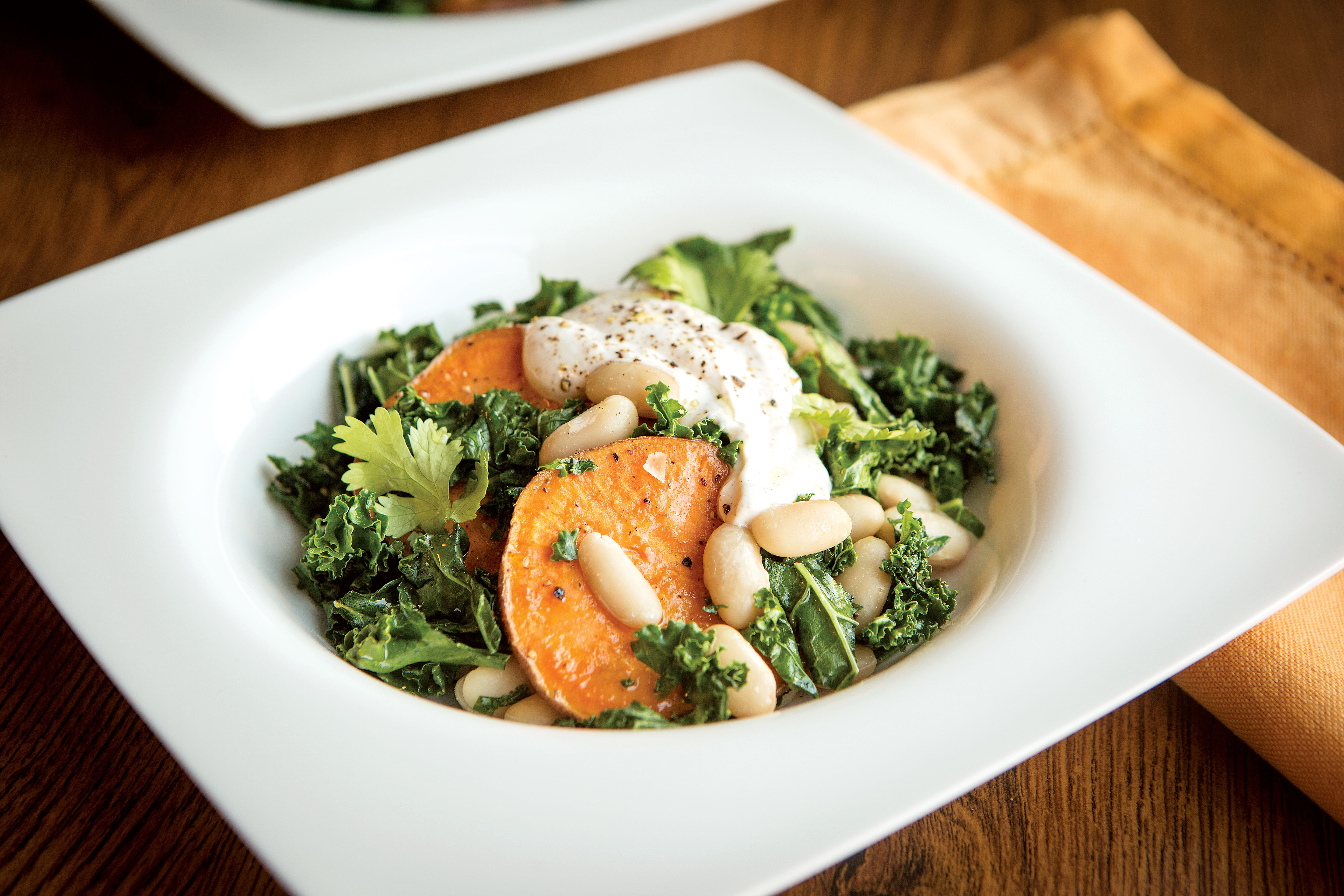 White Bean, Sweet Potato, and Kale Toss with Spiced Garlic Yogurt