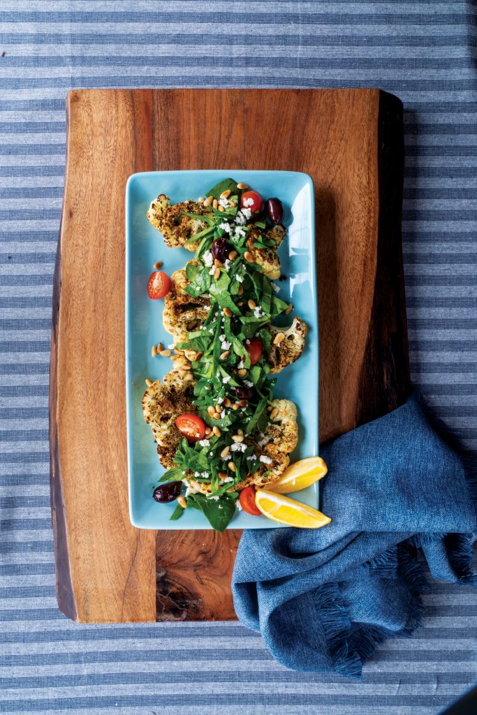 Creole Cauliflower Steaks with Spinach, Tomatoes, and Pine Nuts