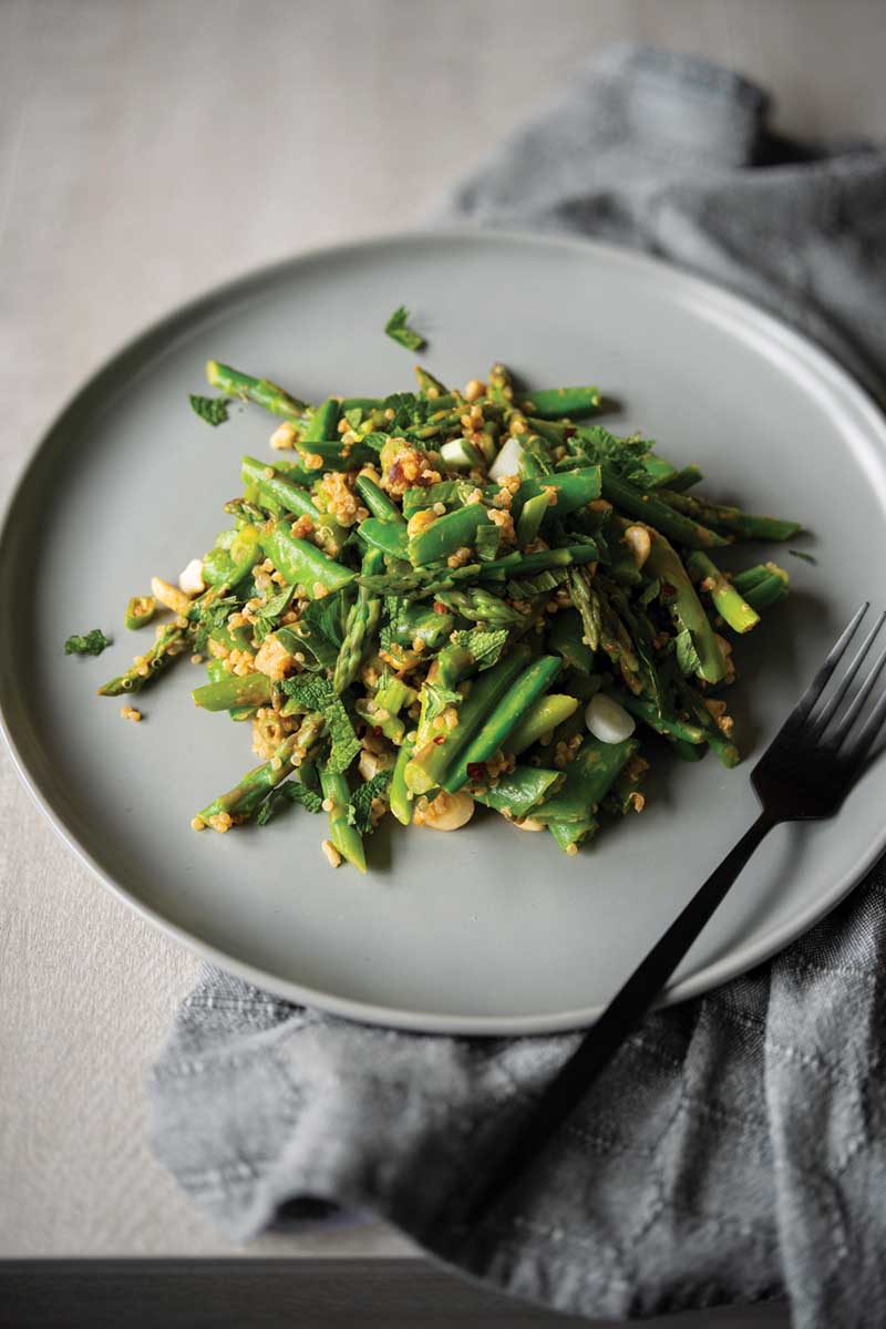Snap pea asparagus and quinoa salad with peanut dressing