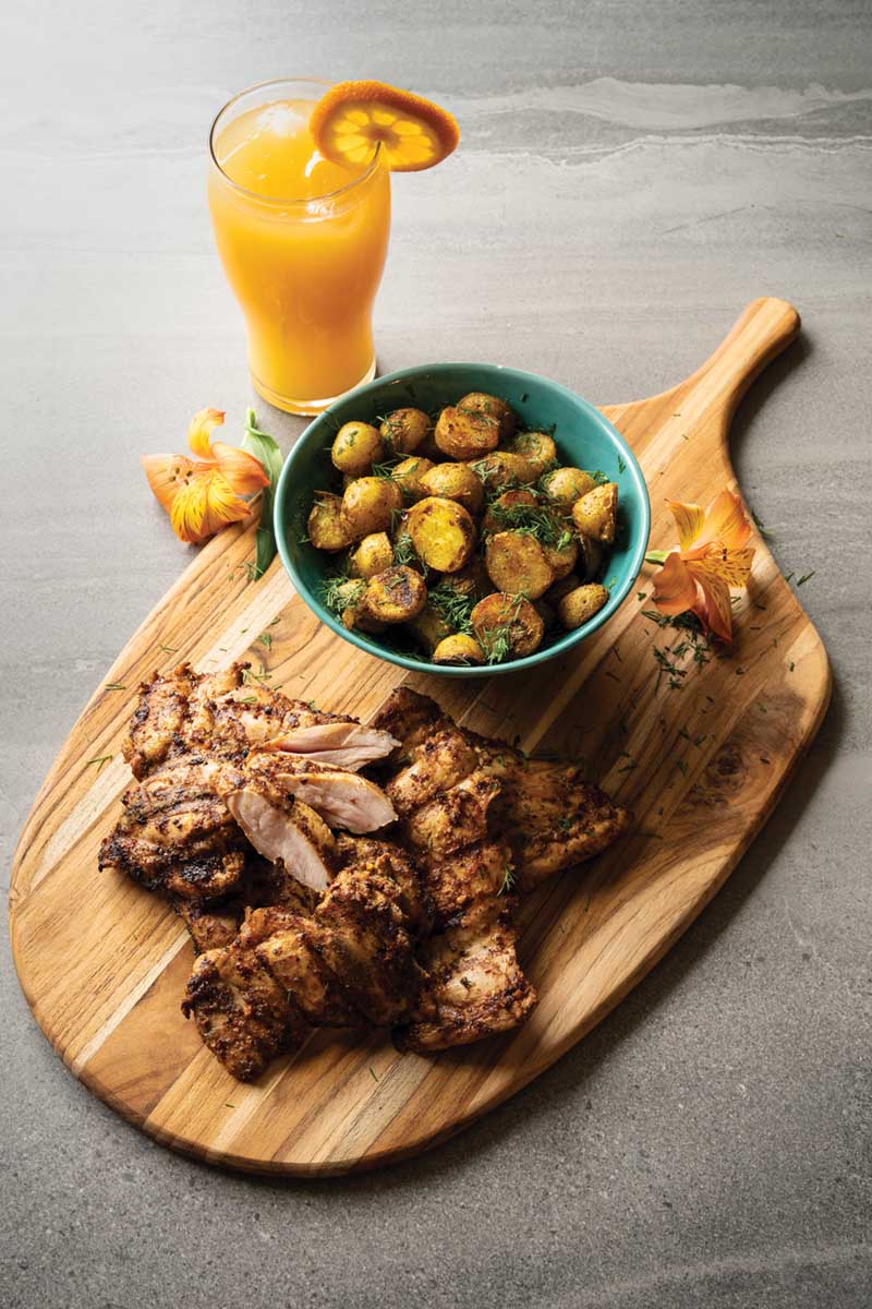 Harissa smothered chicken and grilled potatoes